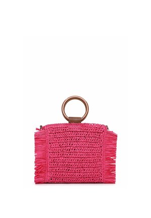 Small bright pink woven clutch bag with fringed sides and a large round wooden handle at the top center.