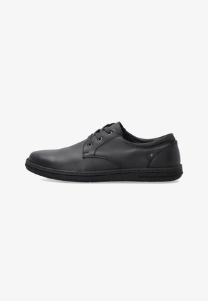 Black leather lace-up casual men's shoe with stitched sole and padded collar, viewed from the inner side on a white background.