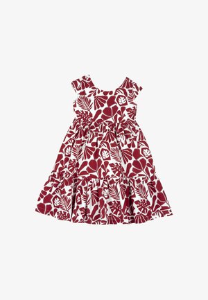 Robe florale rouge et blanche avec des manches capes, taille froncée et ourlet en volants. Présente un motif de feuilles tropicales sur le tissu.