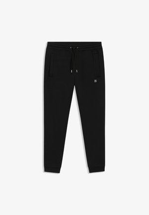 Schwarze Jogginghose aus weichem Stoff mit elastischem Bund, verstellbarem Kordelzug und seitlichen Taschen. Verfügt über ein kleines Logo-Detail.
