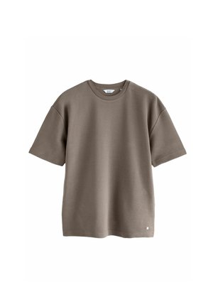 Khaki short-sleeved t-shirt made of textured fabric with a round neckline and a small logo detail at the bottom left hem.