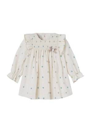 Langärmliges cremefarbenes Kleid mit Rüschenkragen, ausgestattet mit blauen und beigen Pünktchen sowie einer dekorativen Schleife mit einem Knopfdetails auf der Vorderseite.