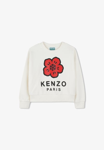 Sweatshirt blanc avec un graphique de fleur rouge, "KENZO" en lettres noires en gras, et une coupe courte. Texture douce et poignets côtelés.