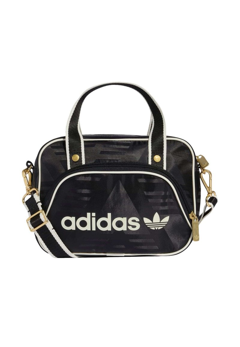 Czarna torba Adidas z złotymi elementami, białymi akcentami, zamkiem błyskawicznym, fakturowanym wzorem, podwójnymi uchwytami i odpinanym paskiem na ramię.