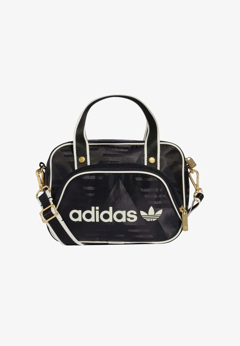 Czarna torba Adidas z złotymi elementami, białymi akcentami, zamkiem błyskawicznym, fakturowanym wzorem, podwójnymi uchwytami i odpinanym paskiem na ramię.