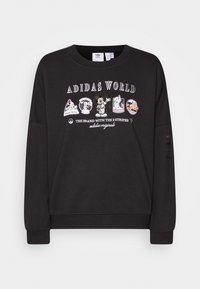 Svart sweatshirt med rund hals, som har färgglada grafiska tryck av karaktärer och logotyper på framsidan och elastiska muddar vid fållen.