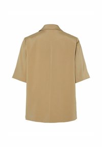 Veste beige à manches courtes avec un col, texture lisse, coupe droite, et sans fermetures ni détails visibles au dos.