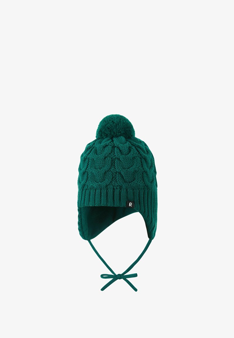 Green knitted hat with cable pattern, pom-pom on top, ear flaps, and adjustable ties. Features a small black logo tag.