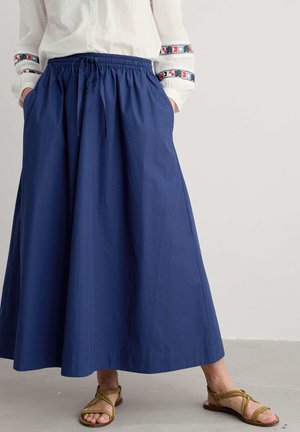 Navy blue maxi skirt made of lightweight fabric, featuring an elastic waistband, drawstring detail, and side pockets.