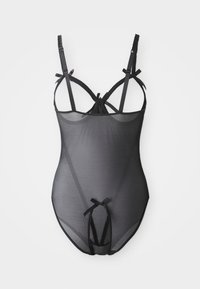 Black sheer bodysuit featuring adjustable straps, a low back design, and decorative bows at the shoulders and bottom. Elastic material.