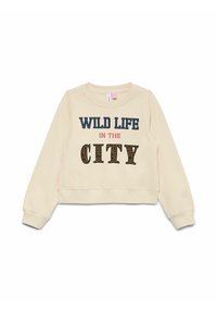 Kortärmad krämfärgad sweatshirt med texten "WILD LIFE IN THE CITY". Mörkblå och röda bokstäver med djurmönstrade inslag på "CITY."