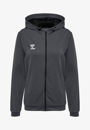 Grå hættejakke med lynlås, sort lynlås og tekstureret stof. Har et logo på venstre bryst samt ribbede manchetter og kant.