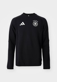 T-shirt de sport noir à manches longues Adidas avec le logo de football de l'Allemagne et quatre étoiles sur la poitrine, présenté sur un fond uni.