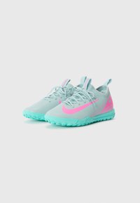 Light blue athletic shoes with pink accents, featuring a textured upper, lace closure, and a rugged, turquoise outsole for grip.