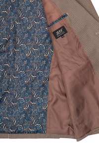 Giacca su misura con esterno a motivo houndstooth marrone. Foderata con un motivo paisley blu e interni di raso marrone. Include etichetta interna.