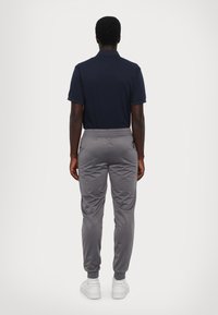 EA7 Emporio Armani TRAIN CORE SUIT - Melegítő - light blu/grey