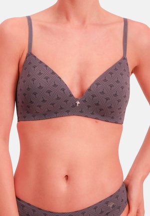 Reggiseno wireless grigio con design scollo a V, caratterizzato da un piccolo motivo floreale e tessuto leggero. Spalline regolabili e dettaglio accentuato sottile al centro.