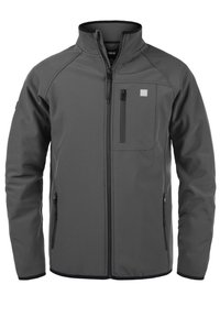 Graue Softshell-Jacke mit hohem Kragen, Reißverschluss-Brusttasche, zwei Seitentaschen und kontrastierendem schwarzen Besatz entlang des Saums und der Bündchen.