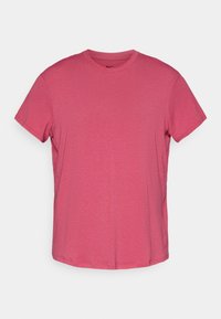 Vaaleanpunainen lyhythihainen puuvillapaita, jossa on pyöreä kaula-aukko ja hienovarainen pinta, edessä pieni musta Nike-logo.