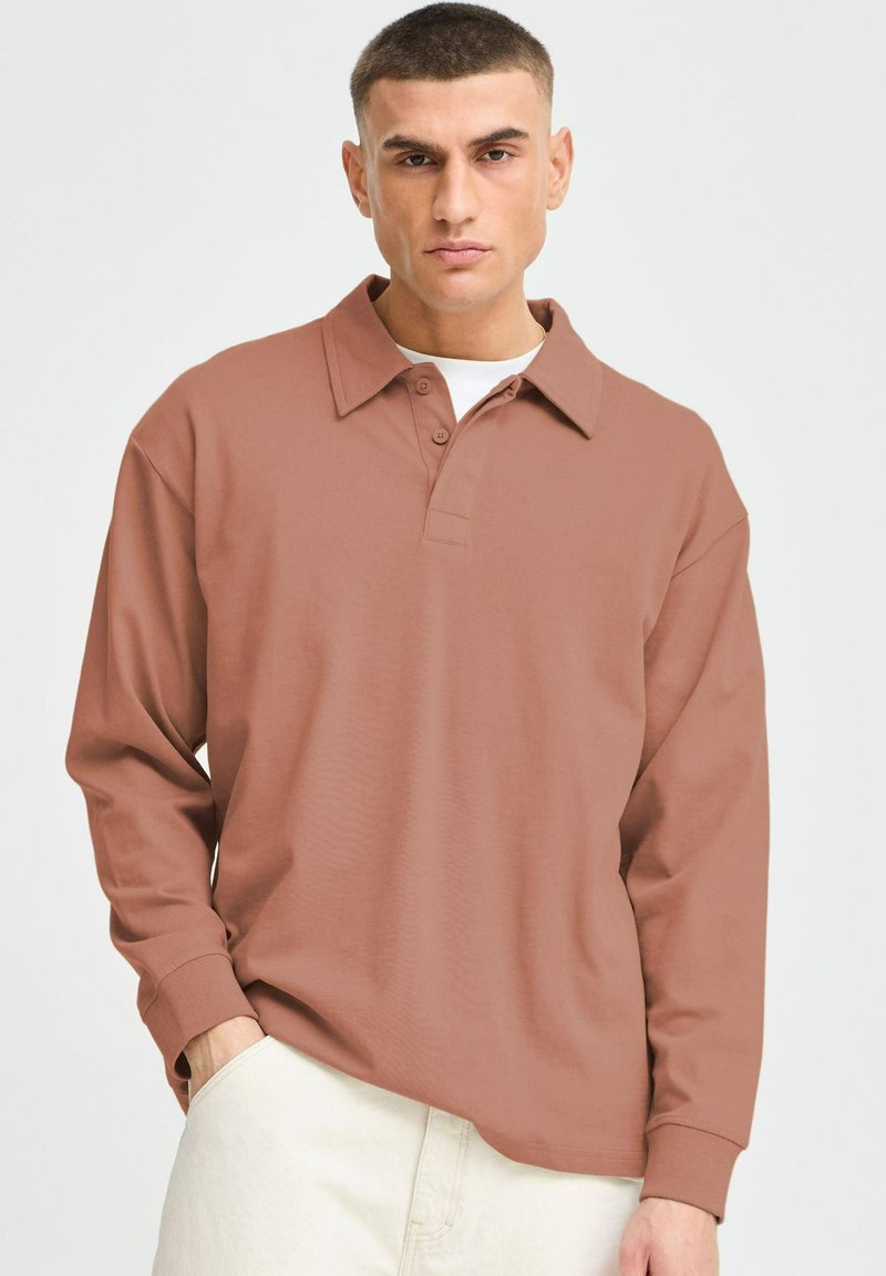 Langærmet polo shirt i støvet rosa farve, med knaplukning, fold-over krave og afslappet pasform, lavet af glat bomuldsstof.