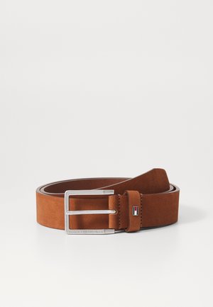 Brown suede belt with a silver rectangular buckle, featuring a leather keeper, and a small logo accent in red, white, and blue.