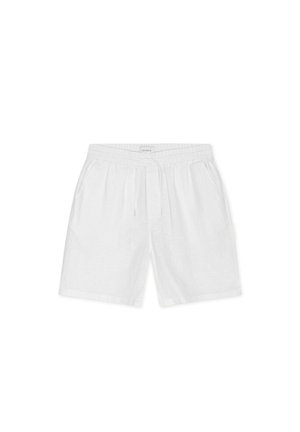 Shorts décontractés en lin blanc avec taille élastique, cordon de serrage et poches latérales, posés à plat sur un fond blanc.
