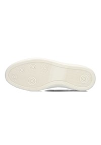 Witte rubber zool van een schoen met cirkel- en zigzagpatronen, een gladde oppervlakte en afgeronde randen. Gedetailleerd ontwerp met een gelijkmatige textuur.