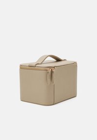 Beige rectangular cosmetics bag made of textured material, featuring a top handle and gold zipper accents. Compact with a structured design.
