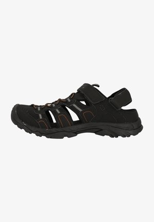 Black outdoor sandal with Velcro strap, rubber sole, textile upper, open design, orange stitching accents, and multiple ventilation openings.