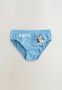 Brassière de bain en coton bleu clair avec un design de chien de cartoon sur le côté et le texte "BLUEY" en blanc. Taille élastique.
