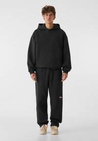 Lost Youth CORE COMFORT - Spodnji deli trenirk - black