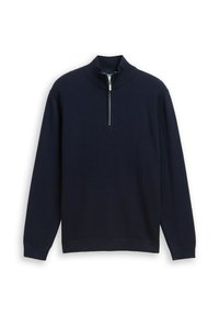 Granatowy sweter z wysokim kołnierzem, zapinany na zamek z przodu oraz w teksturę w rybi wzór. Długie rękawy z prążkowanymi mankietami i dołem.