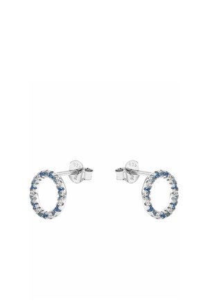 Silver stud earrings shaped as open circles, each adorned with alternating small blue and clear gemstones.