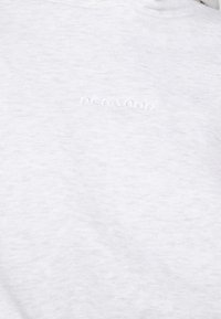 Light gray sweatshirt featuring a soft texture, a hood, and a small embossed logo reading "PEGAZOR" on the chest. Minimalist design.