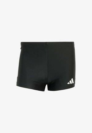 Crne atletske kratke hlače izrađene od glatkog, rastezljivog materijala. Imaju bijeli Adidas logo s lijeve strane. Čist, jednostavan dizajn.