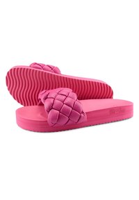 Pink flip-flop sandals featuring a woven strap design, smooth rubber sole, and textured bottom for grip. Accented with the brand name "flip flop."