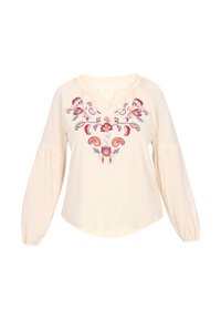 Blusa crema con motivo floreale ricamato in rosso, blu e verde. Presenta un collo a V e maniche a sbuffo lunghe. Tessuto morbido e leggero.