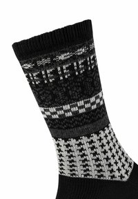 Calze al ginocchio nere con motivi geometrici bianchi, dotate di una texture a costine nella parte superiore e disegni a scacchi lungo il gambale.