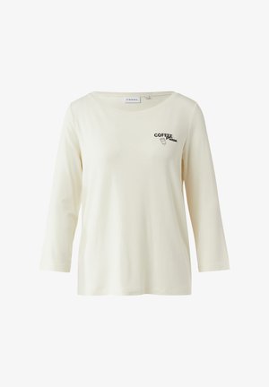 Maglietta a maniche lunghe color crema, realizzata in tessuto morbido. Presenta una scollatura rotonda e una grafica sul petto con la scritta "COFFEE Please" in nero.