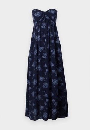Strapless maxi-jurk in marineblauw met een blauw bloemenpatroon, met een geraffineerde borst en een vloeiende silhoutte. Zachte stof met een gladde textuur.
