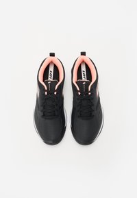 Black athletic shoes with pink accents, textured synthetic upper, cushioned collar, and rubber outsole. Laces and ventilation holes included.