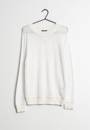 Maglione bianco a maniche lunghe con scollo rotondo e polsini a costine. Realizzato in materiale morbido, presenta una leggera trasparenza e un branding minimale.
