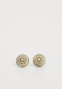 Boucles d'oreilles dorées au design floral, ornées de cristaux transparents et d'une base circulaire lisse avec des accents irisés.