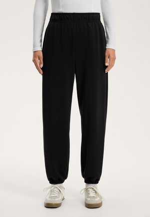 SOFT-TOUCH JOGGERS - Tracksuit bottoms - black