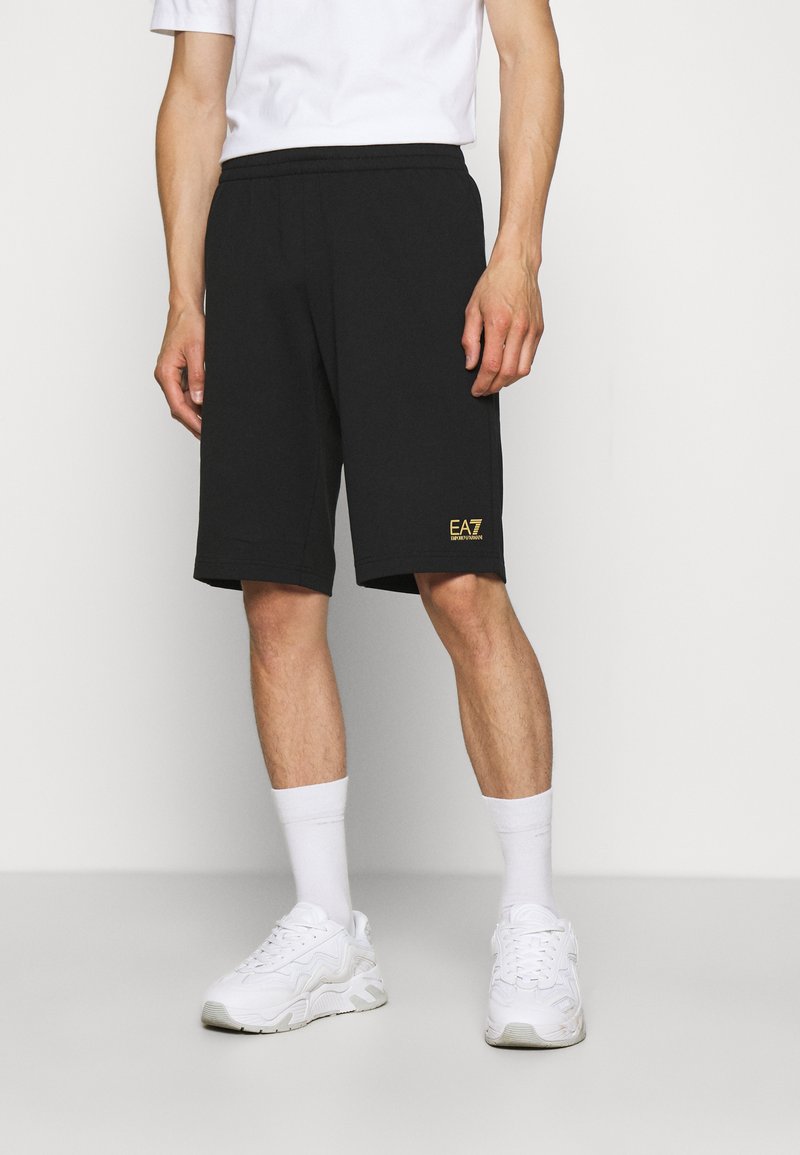 EA7 Emporio Armani BERMUDA - Pantalones deportivos - black/gold-coloured