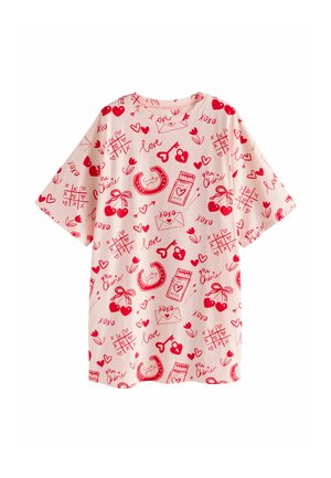 Short-sleeve, oversized T-shirt in light pink with red doodle patterns including hearts, cherries, and words like "love" and "xoxo."