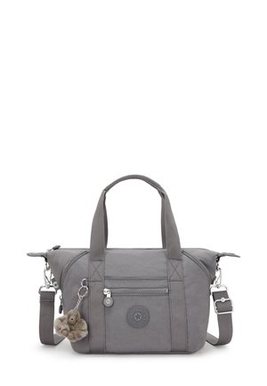 Gray nylon handbag with dual short handles, adjustable shoulder strap, zippered main compartment, and decorative fur monkey keychain.