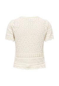 Haut en maille blanche avec un motif texturé, des manches courtes et un ourlet festonné. Le design comprend des motifs en losange et en chevron.