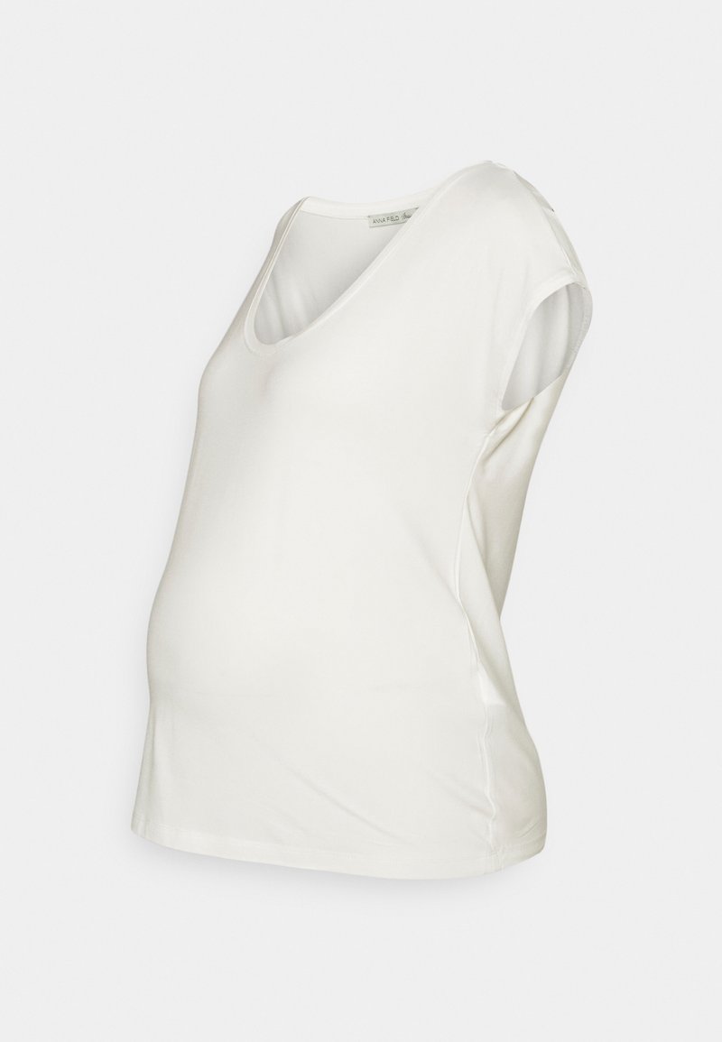 Top de maternidade branco com decote em V, mangas curtas e ajustadas, e um corte solto, feito de um tecido macio e elástico para conforto. Textura suave.