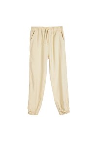 Beige joggerbukser med snoretræk i taljen, elastiske manchetter og sidelommer. Fremstillet af et blødt, letvægtsstof.